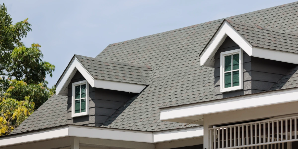 Architectural asphalt shingle roof with dormer windows on a home