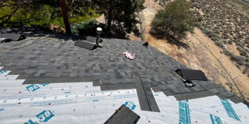 Asphalt shingle roof replacement in progress on a Reno Nevada home with underlayment visible