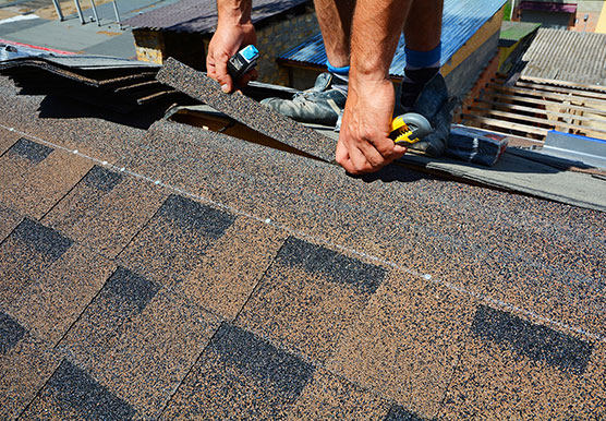 Mills roofing employee performing maintenance on Nevada roof