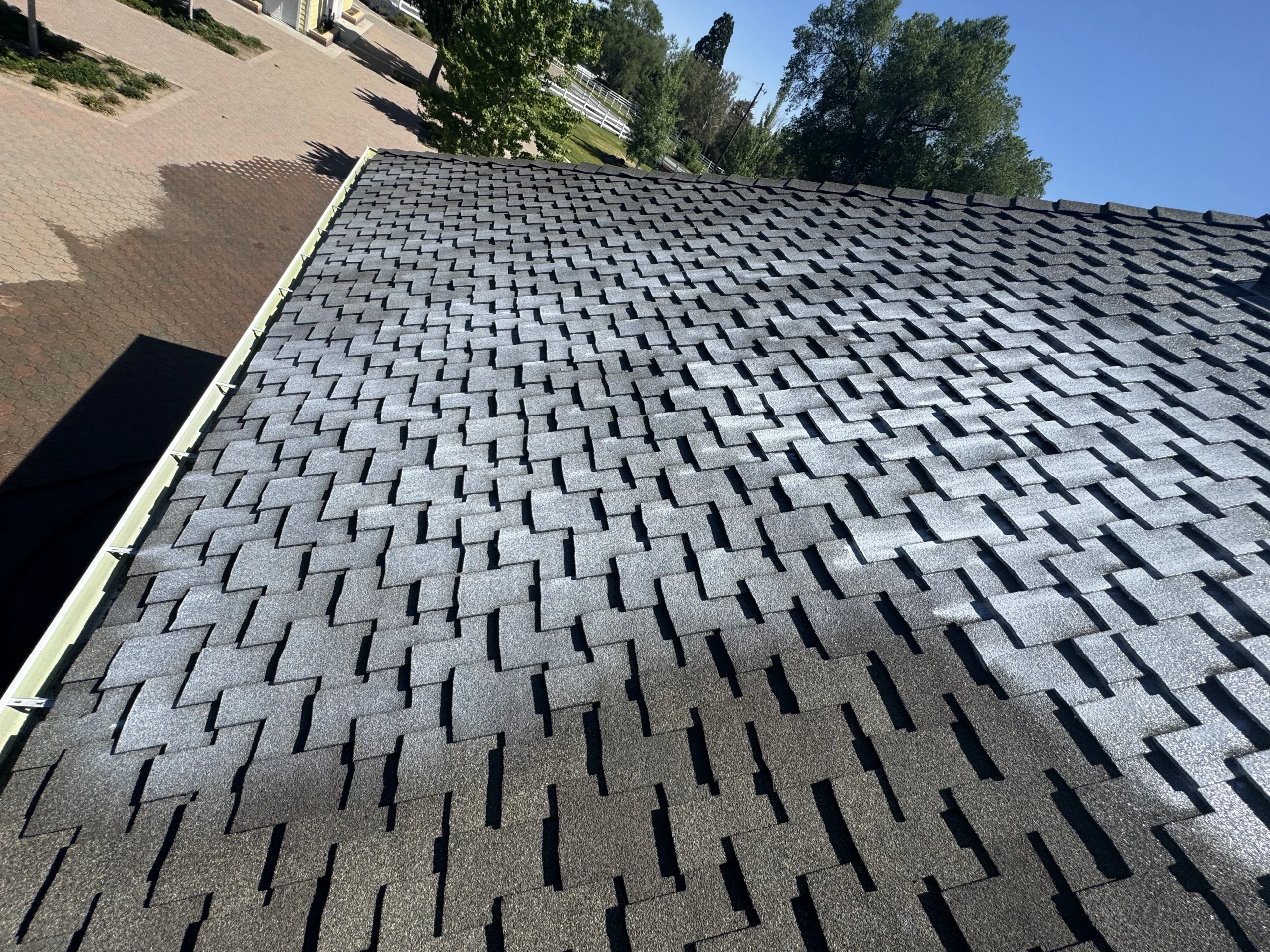 Close-up of an aging residential asphalt shingle roof in Reno, Nevada that may benefit from Roof Maxx roof rejuvenation treatment.