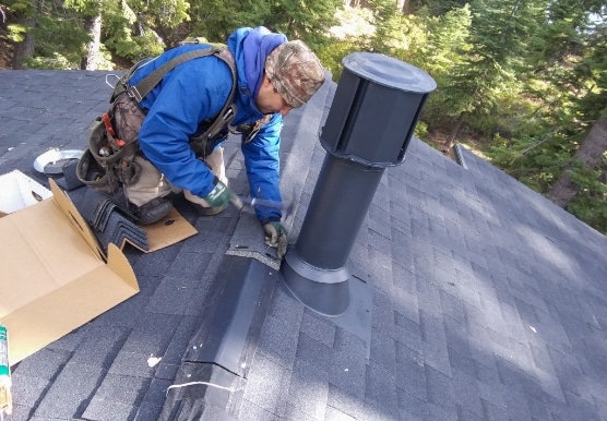 Worker repairing roof on Nevada home