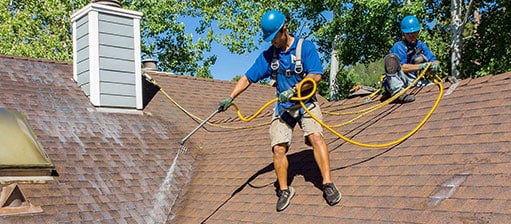 Mills Roofing employee applies Roof Maxx in Fallon-Fernley